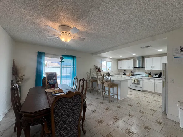 a view of a dining room with furniture