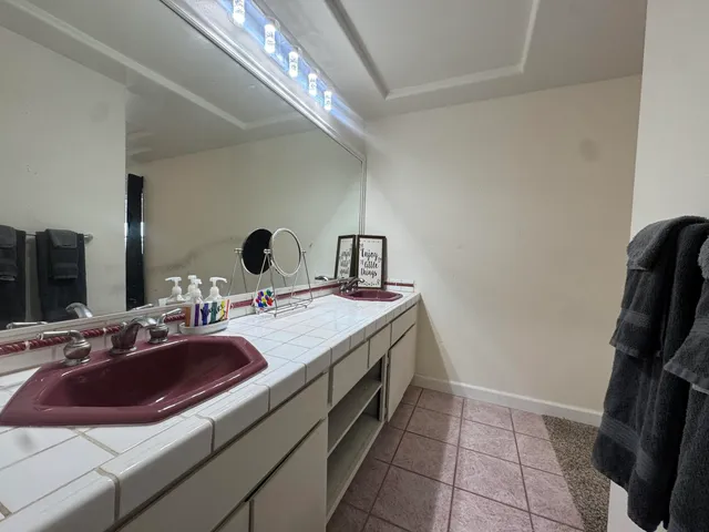 a bathroom with a sink and a mirror