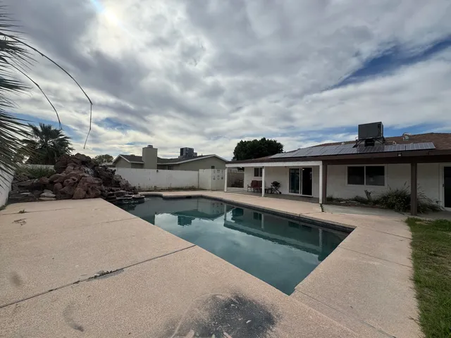 a view of a lake with houses in the back
