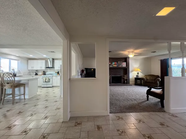 a view of a living room kitchen and a window