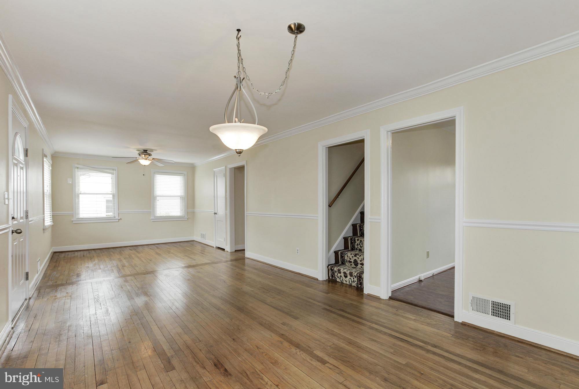 2515 Mason Street Silver Spring, MD 20902 - Photo 3 of 30 a view of an empty room with wooden floor and a window