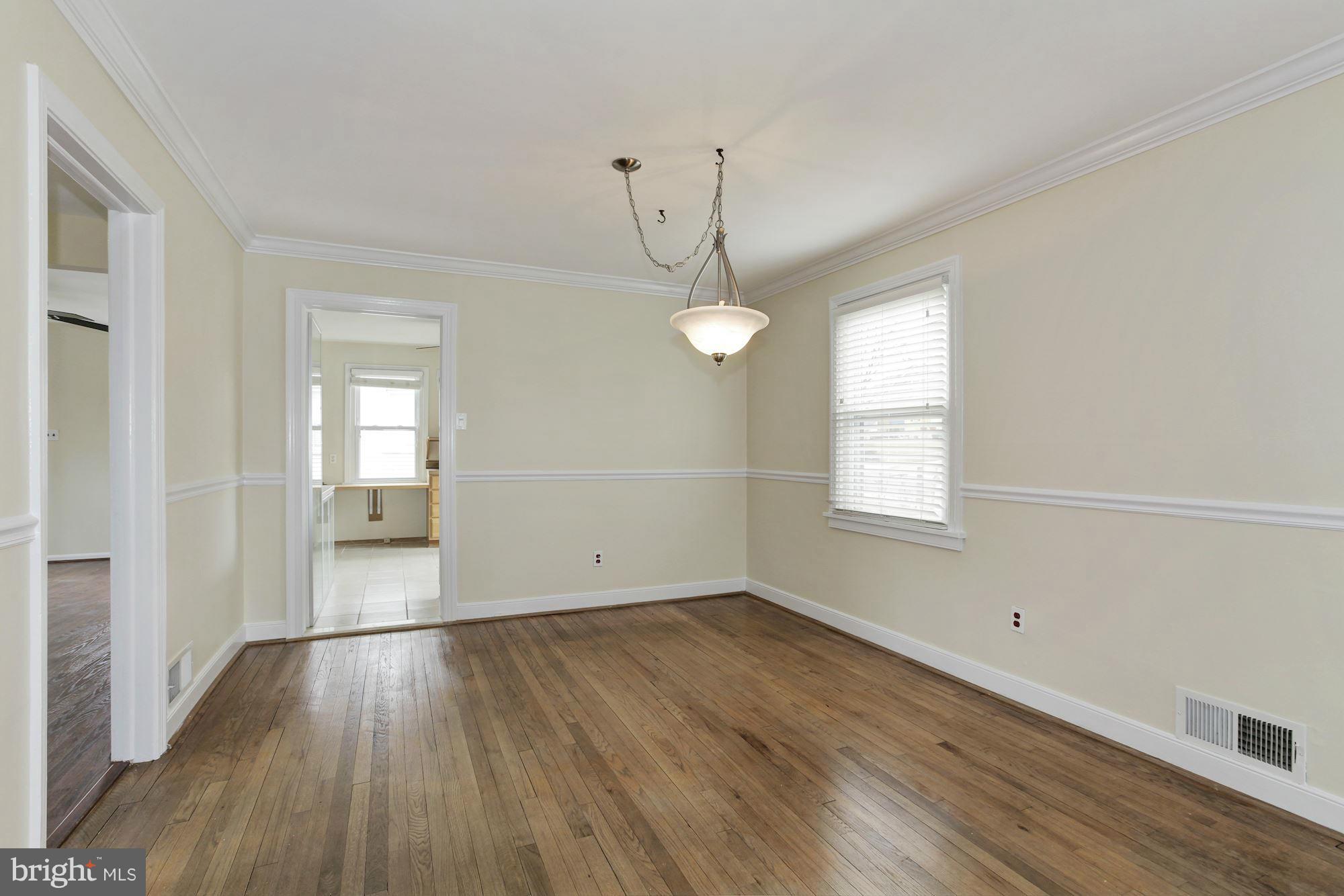 2515 Mason Street Silver Spring, MD 20902 - Photo 4 of 30 wooden floor in an empty room with a window