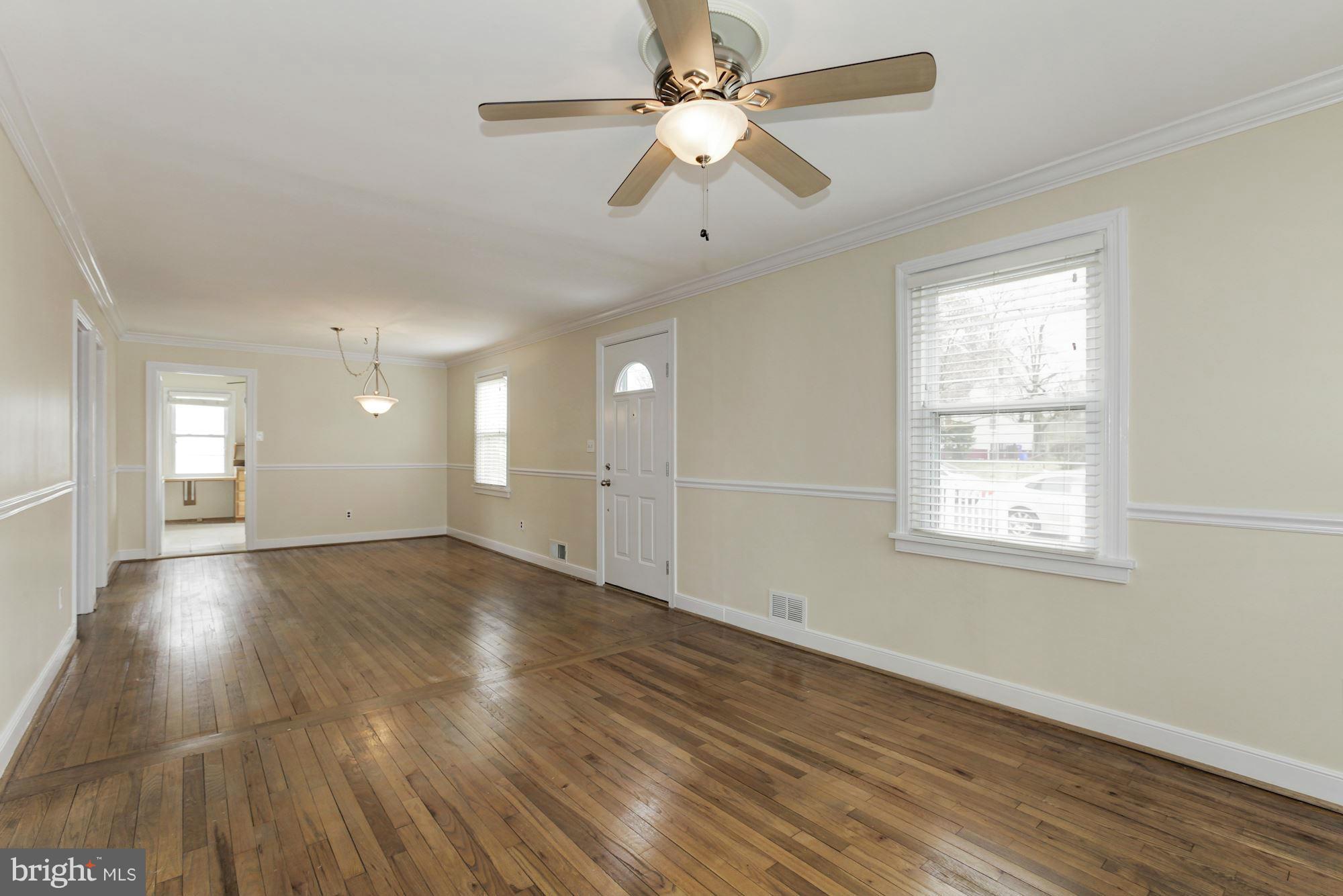 2515 Mason Street Silver Spring, MD 20902 - Photo 5 of 30 a view of an empty room with wooden floor and a window