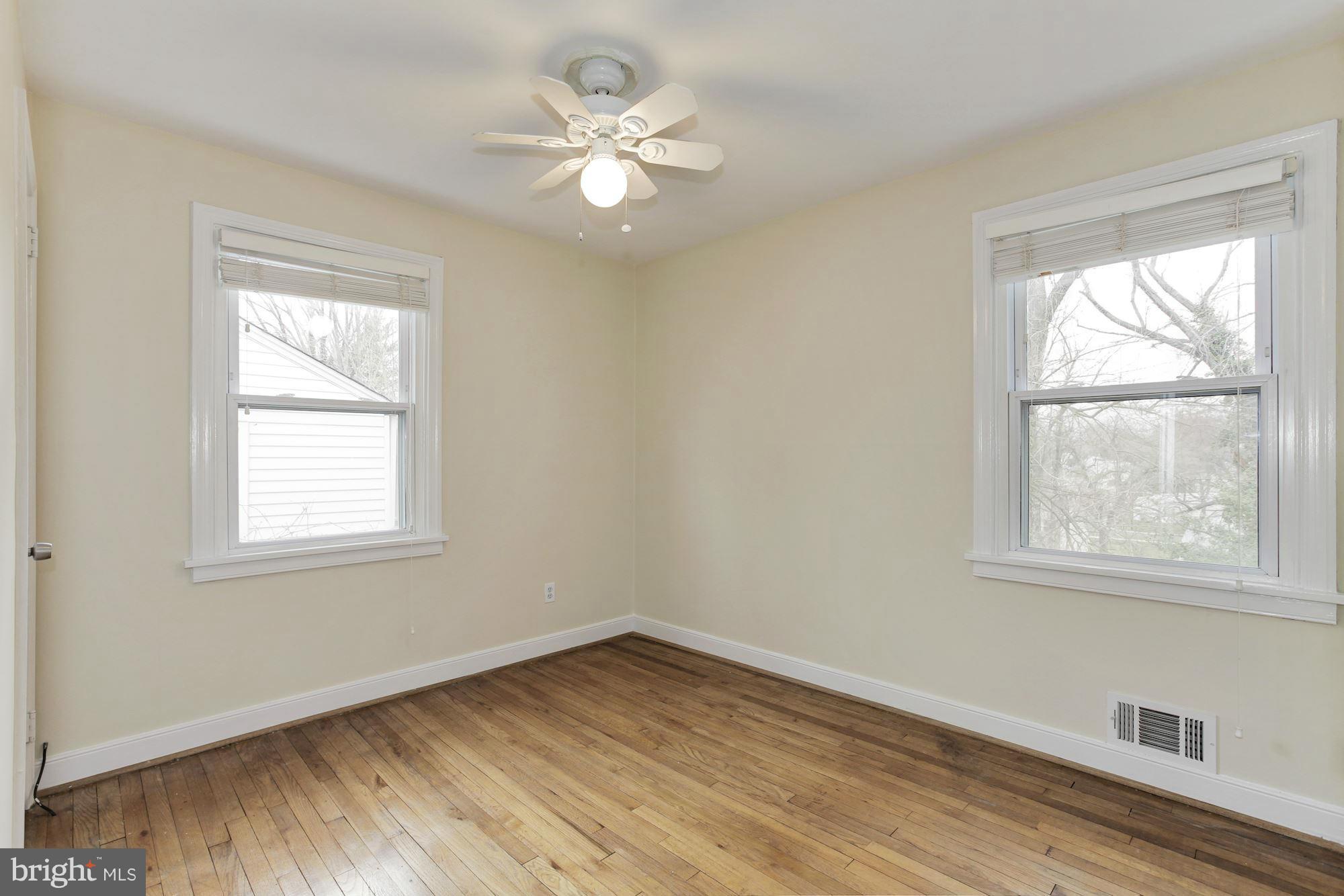 2515 Mason Street Silver Spring, MD 20902 - Photo 6 of 30 an empty room with wooden floor and windows