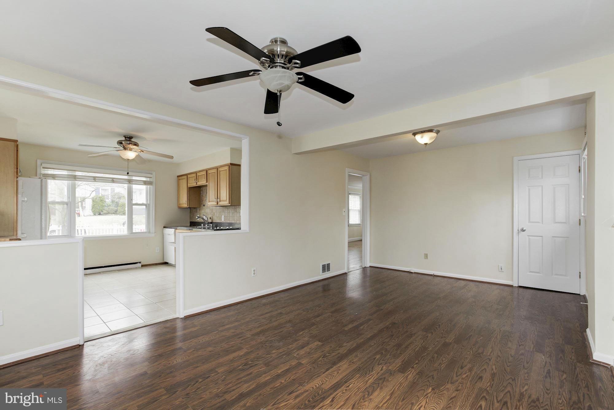 2515 Mason Street Silver Spring, MD 20902 - Photo 9 of 30 a view of an empty room with wooden floor and a window