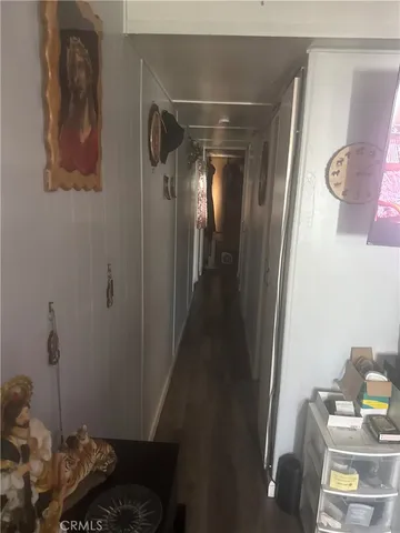 a view of a door and chair in a living room