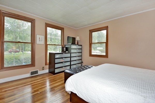 253 West Acton Road Stow, MA 01775 - Photo 11 of 21 a bed sitting in a bedroom next to a window