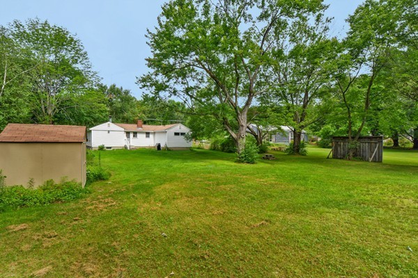 253 West Acton Road Stow, MA 01775 - Photo 19 of 21 a view of a backyard with a garden