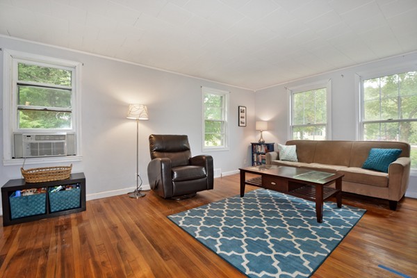 253 West Acton Road Stow, MA 01775 - Photo 4 of 21 a living room with furniture and a wooden floor