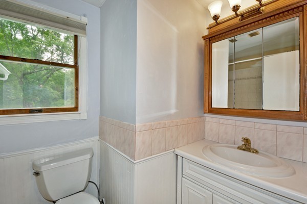 253 West Acton Road Stow, MA 01775 - Photo 10 of 21 a bathroom with a sink and a mirror