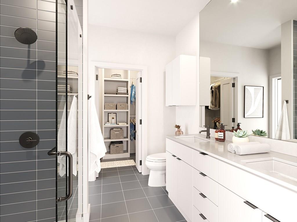 100 West Mockingbird Lane, Unit 403 Austin, TX 78745 - Photo 5 of 13 a bathroom with a double vanity sink mirror and shower