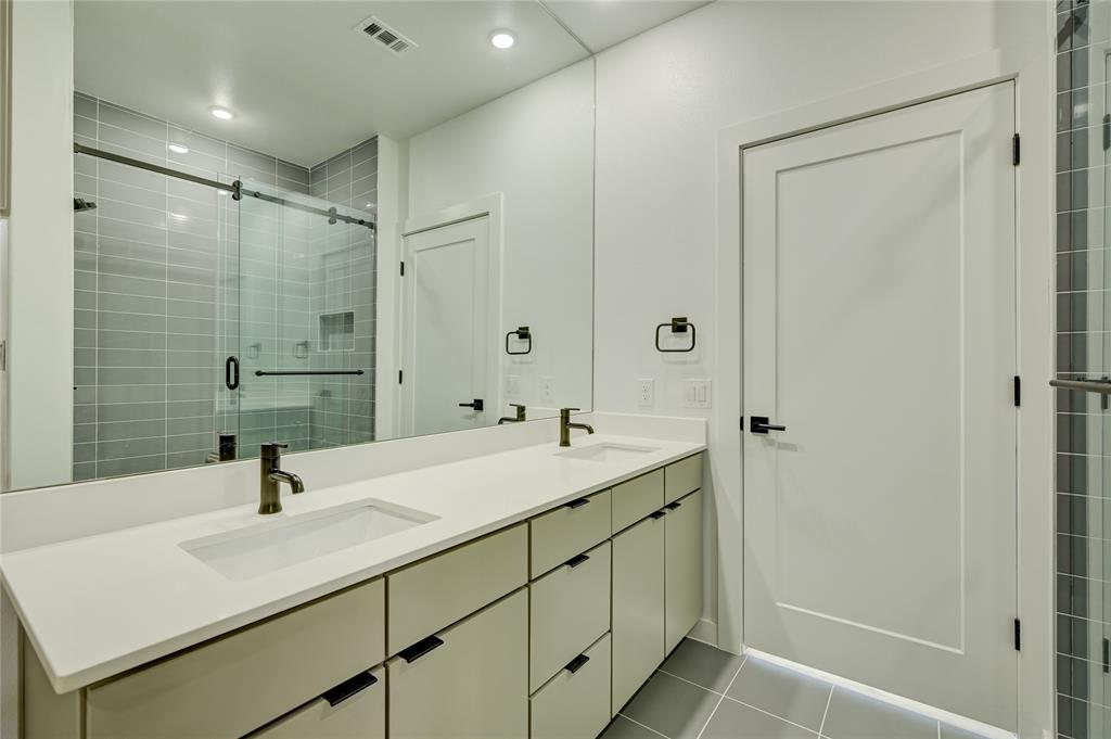 100 West Mockingbird Lane, Unit 403 Austin, TX 78745 - Photo 6 of 13 a bathroom with a sink and a mirror