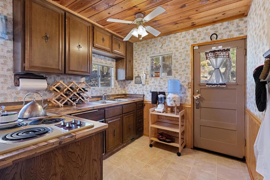 9150- Pine Creek Road, Unit 39 Pine Valley, CA 91962 - Photo 16 of 27 a kitchen with a stove and a sink