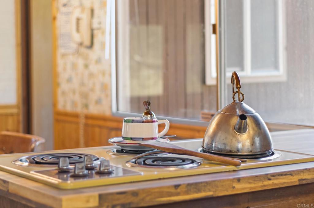 9150- Pine Creek Road, Unit 39 Pine Valley, CA 91962 - Photo 17 of 27 a dining room with table and chairs