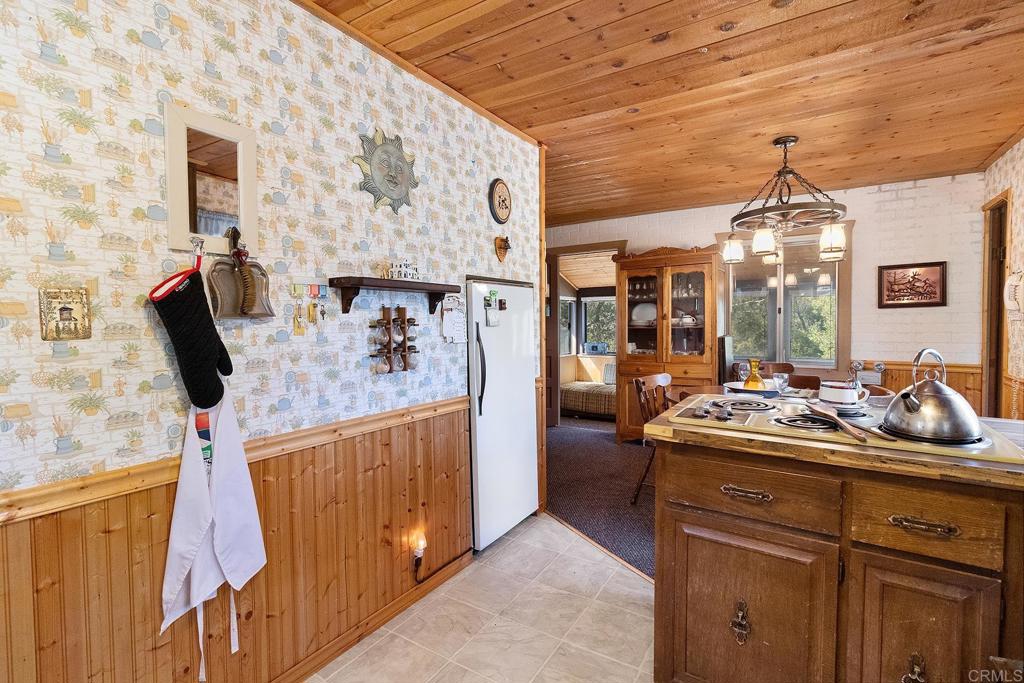 9150- Pine Creek Road, Unit 39 Pine Valley, CA 91962 - Photo 19 of 27 a kitchen with a sink and cabinets