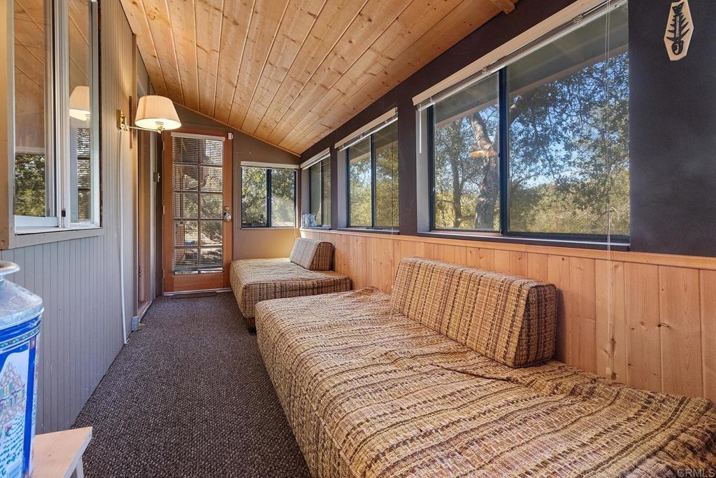 9150- Pine Creek Road, Unit 39 Pine Valley, CA 91962 - Photo 21 of 27 a bedroom with a large bed and a large window