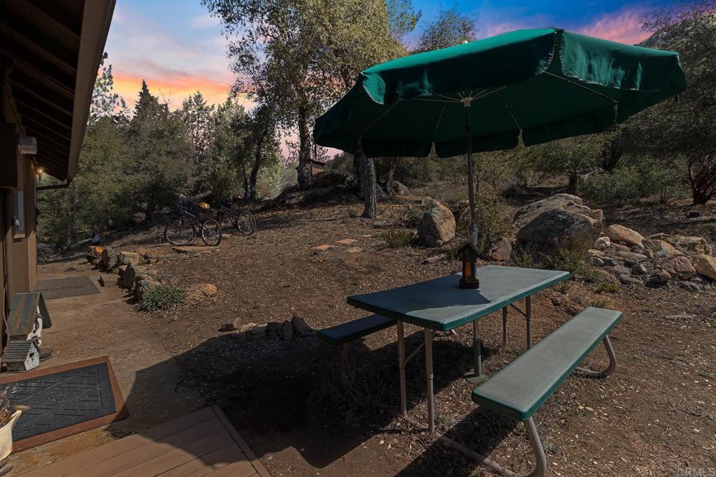 9150- Pine Creek Road, Unit 39 Pine Valley, CA 91962 - Photo 23 of 27 a view of a backyard with sitting area