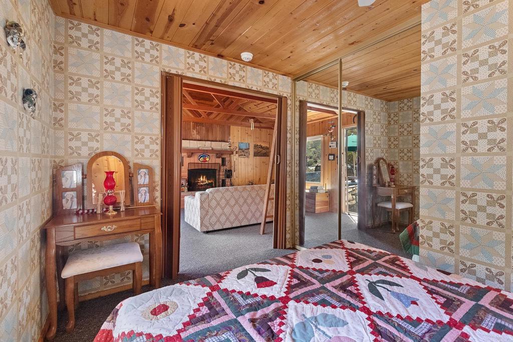 9150- Pine Creek Road, Unit 39 Pine Valley, CA 91962 - Photo 8 of 27 a bedroom with a bed and a dresser