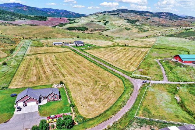 667 Hardscrabble Road Morgan, UT 84050 - Photo 11 of 51 Overview of rural landscape with a mountainous background and rows of crops