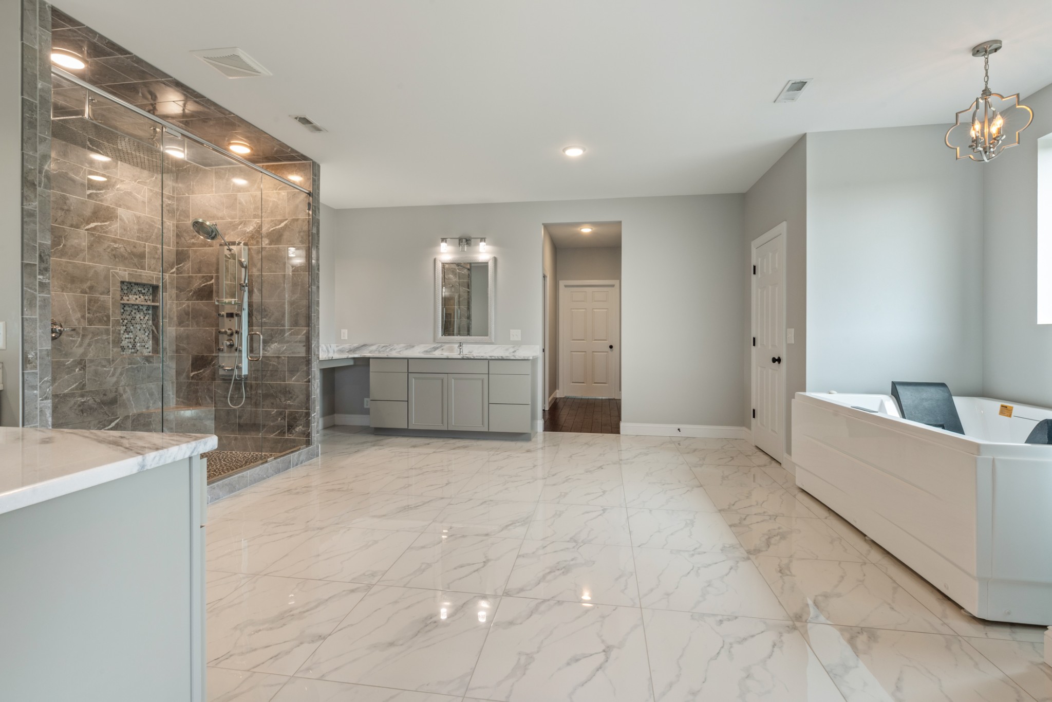 3791 Sylvia Road Dickson, TN 37055 - Photo 34 of 96 a large bathroom with a tub sink shower and mirror