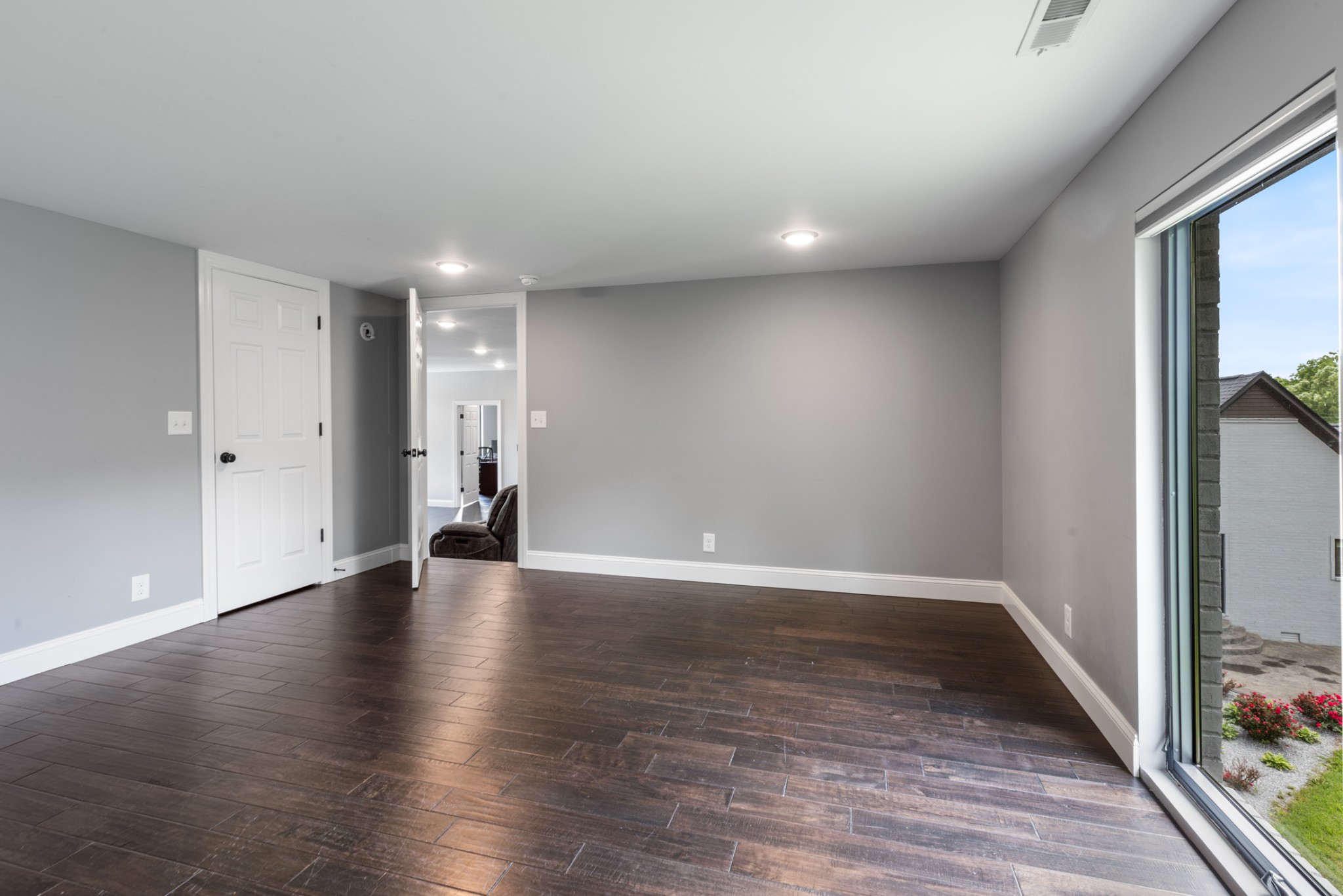 3791 Sylvia Road Dickson, TN 37055 - Photo 56 of 96 a view of an empty room with wooden floor and a window