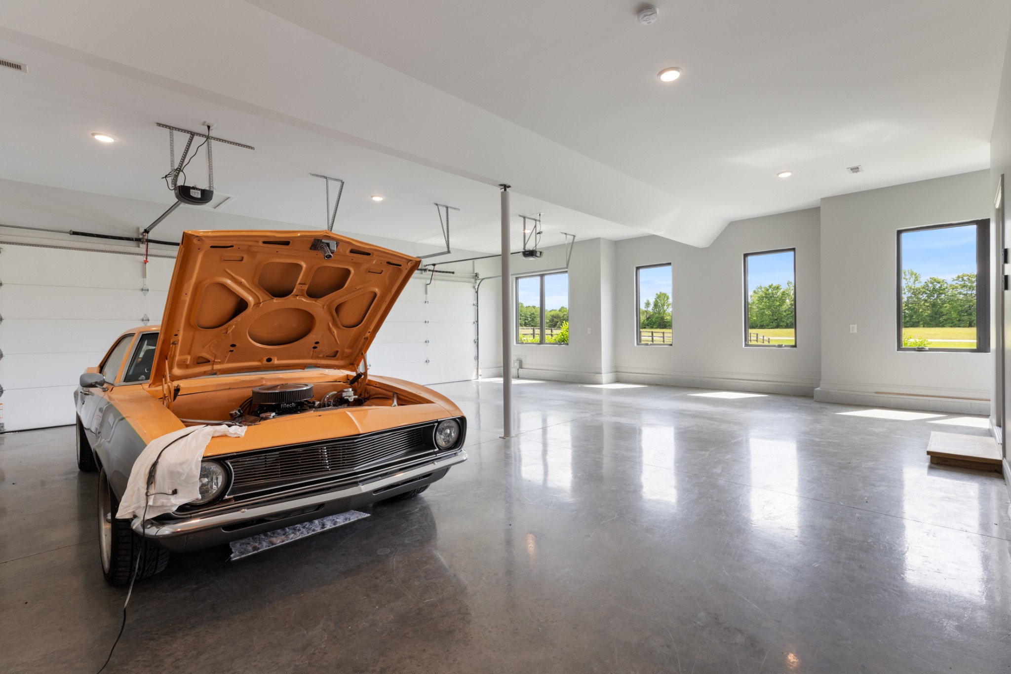 3791 Sylvia Road Dickson, TN 37055 - Photo 61 of 96 a room with gym equipment and wooden floor