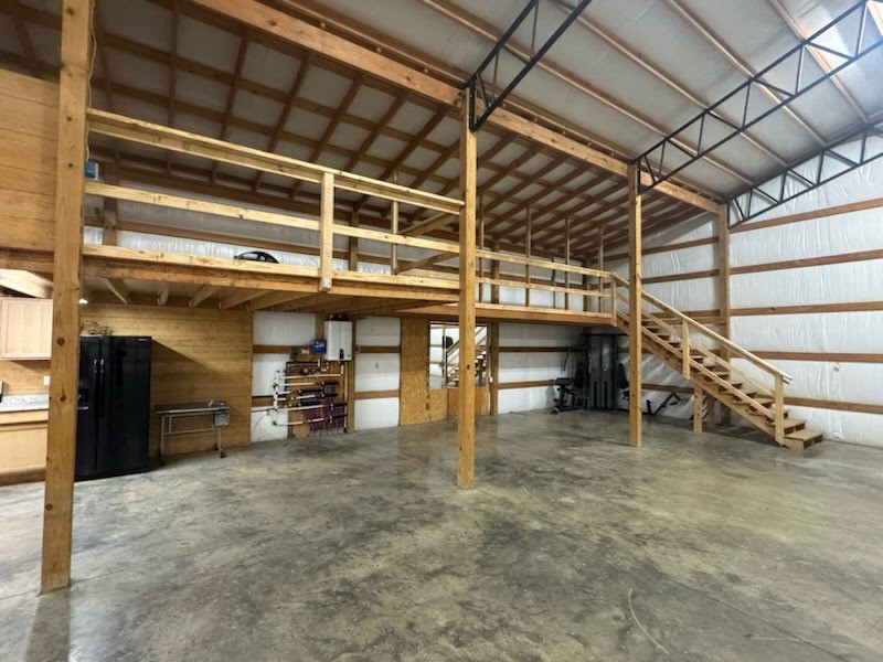 3791 Sylvia Road Dickson, TN 37055 - Photo 77 of 96 a view of a garage with wooden table and chairs
