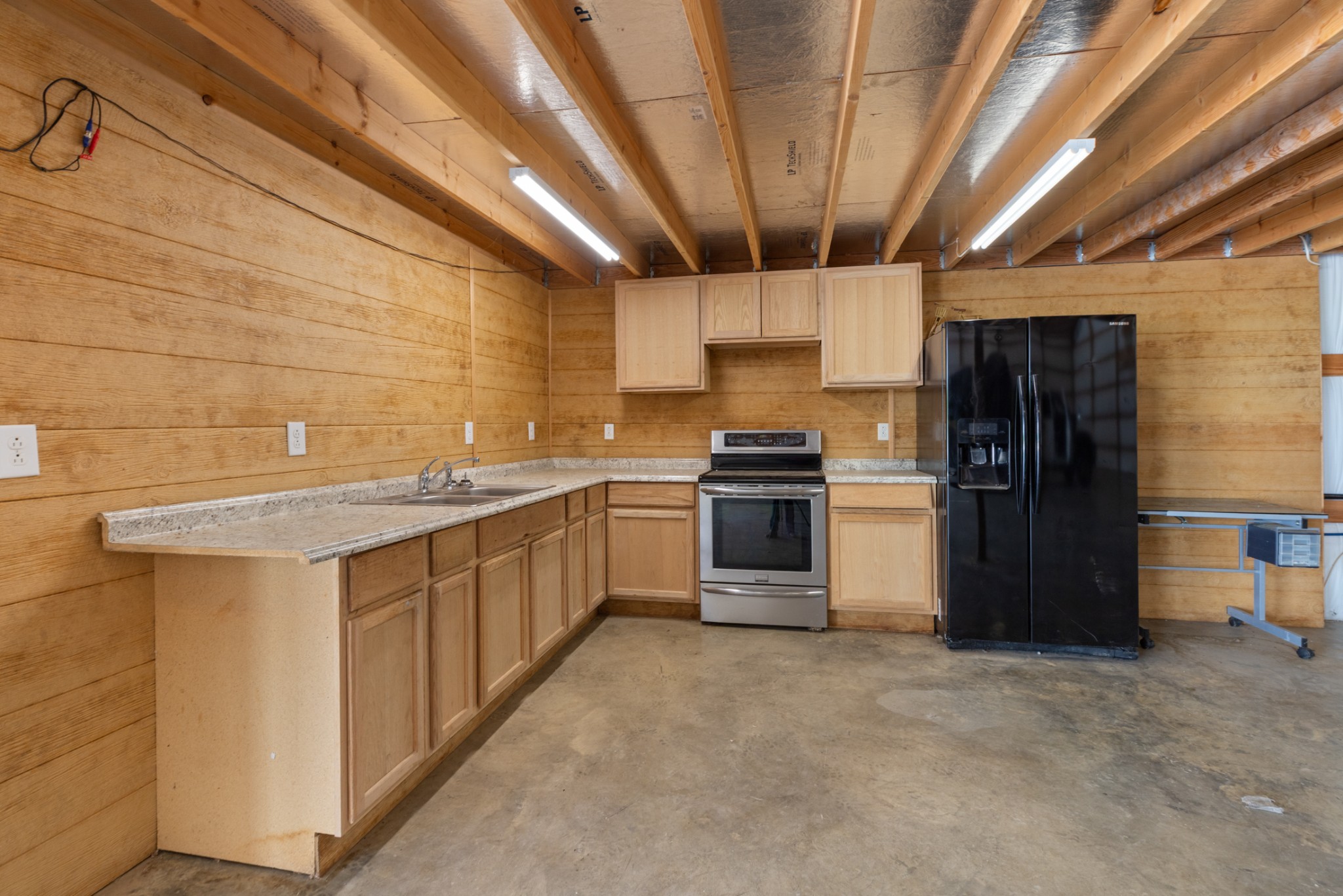 3791 Sylvia Road Dickson, TN 37055 - Photo 80 of 96 a kitchen with stainless steel appliances granite countertop a stove a sink and a refrigerator