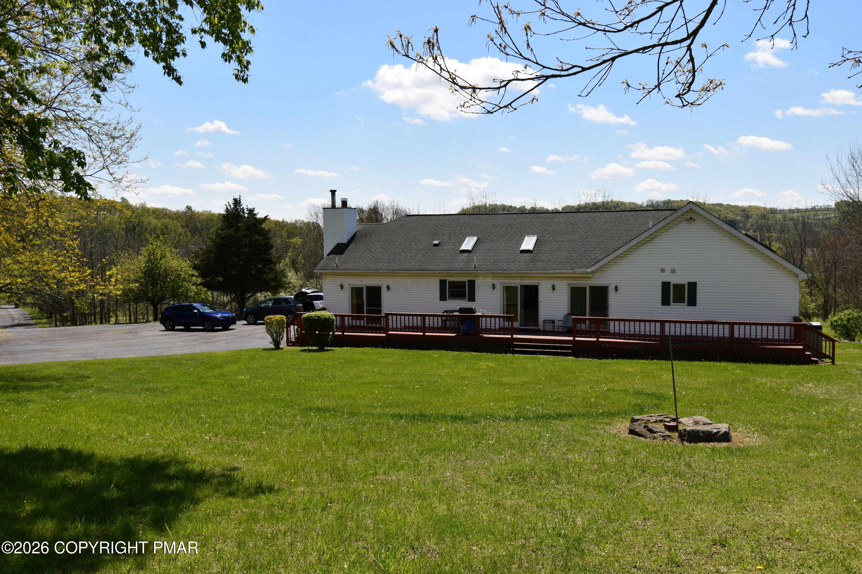 160 Quiet Valley Road Mount Bethel, PA 18343 - Photo 4 of 44 a aerial view of a house with backyard porch and sitting area