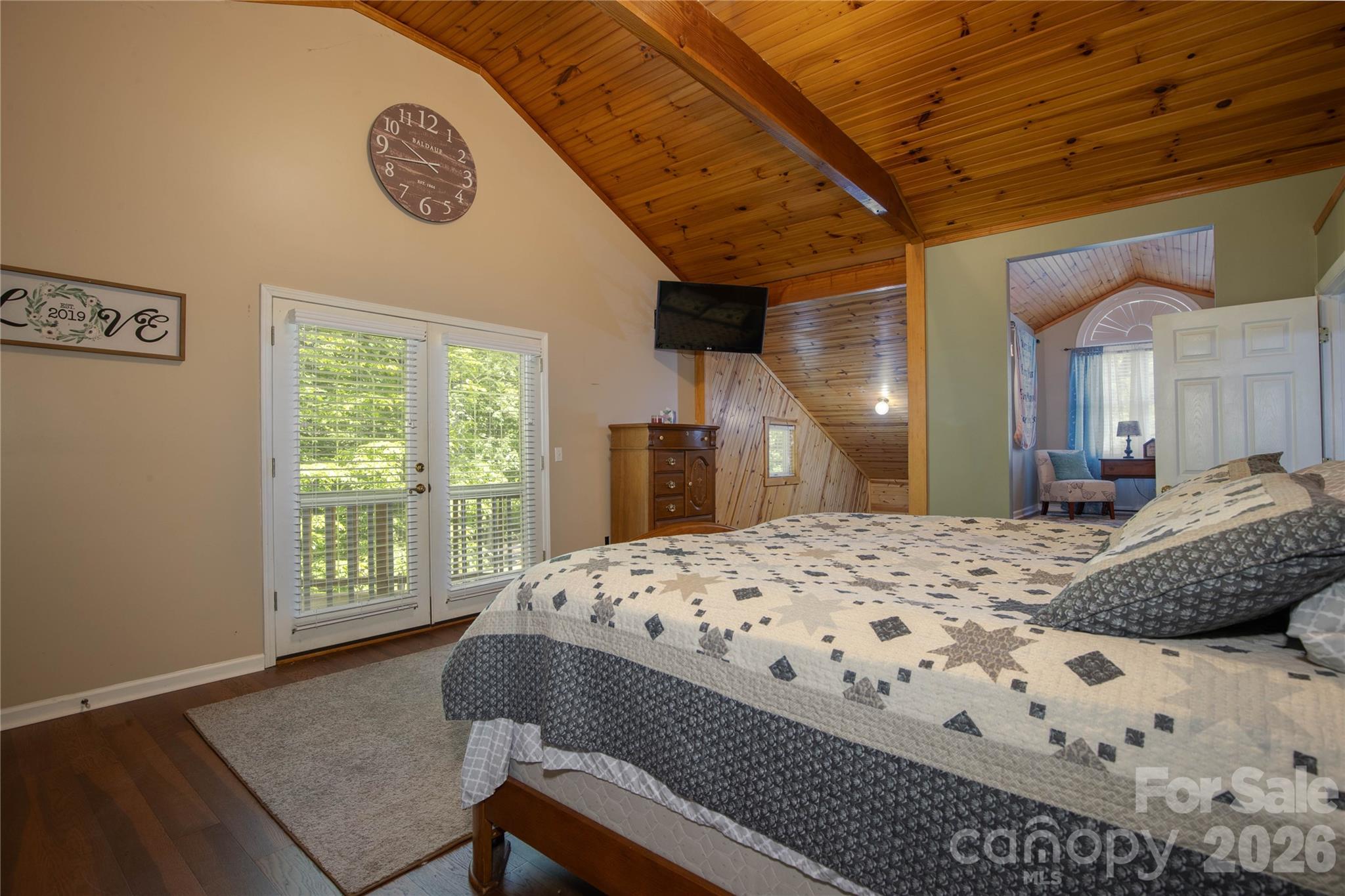 84 Sheets Farm Road Bakersville, NC 28705 - Photo 35 of 42 a living room with a bed furniture and a large window