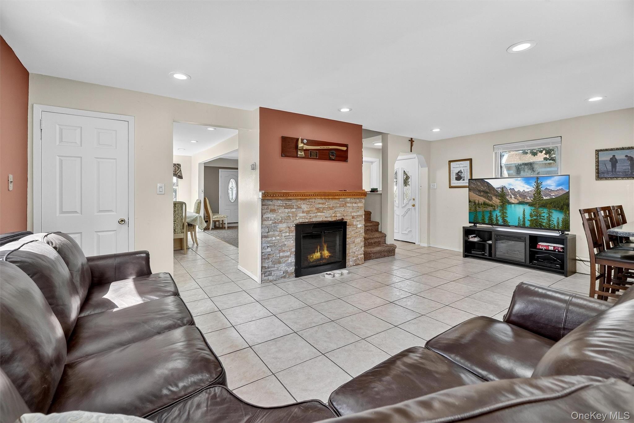 3384 Country Club Road Bronx, NY 10465 - Photo 17 of 48 Living area featuring light tile patterned floors, recessed lighting, and a fireplace