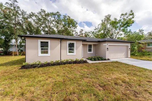 a house with trees in the background