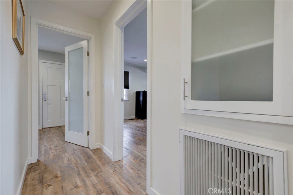 6911 Valmont Street Tujunga, CA 91042 - Photo 12 of 55 a view of a hallway with wooden floor and entryway