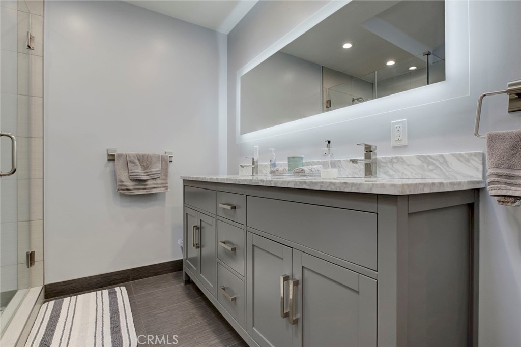 6911 Valmont Street Tujunga, CA 91042 - Photo 13 of 55 a bathroom with a sink and a mirror