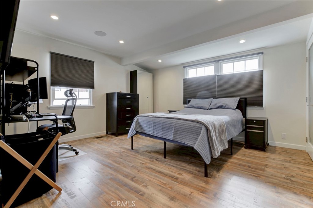 6911 Valmont Street Tujunga, CA 91042 - Photo 15 of 55 a bedroom with a bed and wooden floor