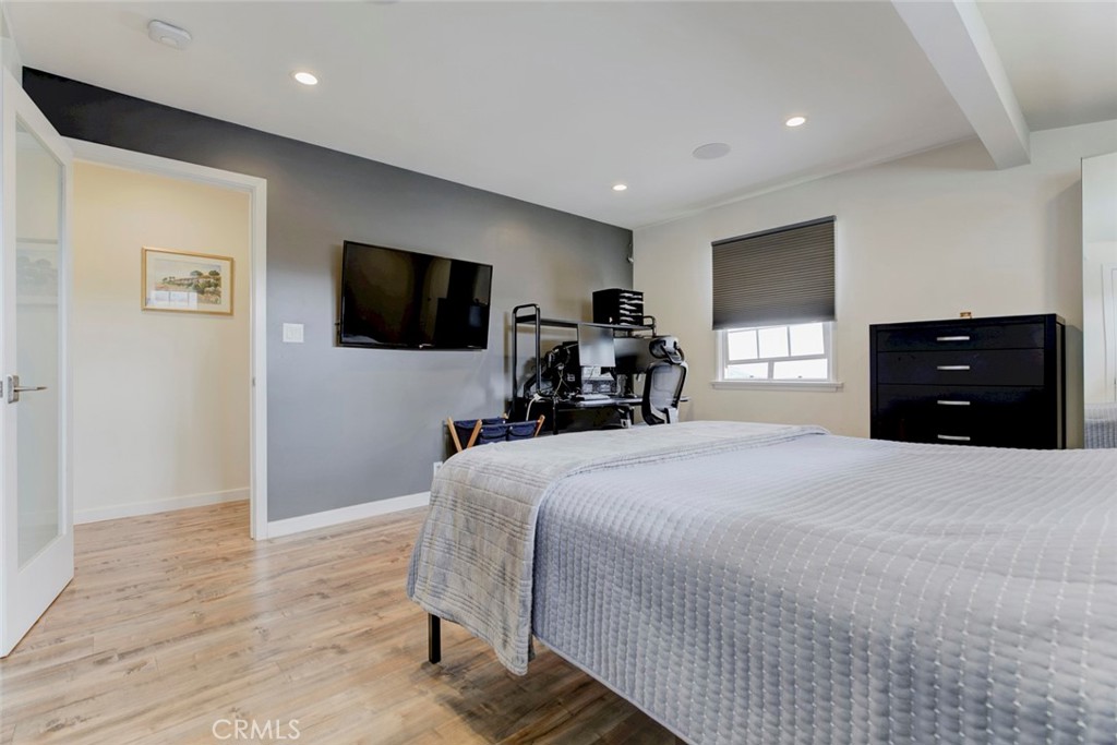 6911 Valmont Street Tujunga, CA 91042 - Photo 16 of 55 a bedroom with a bed and a flat screen tv