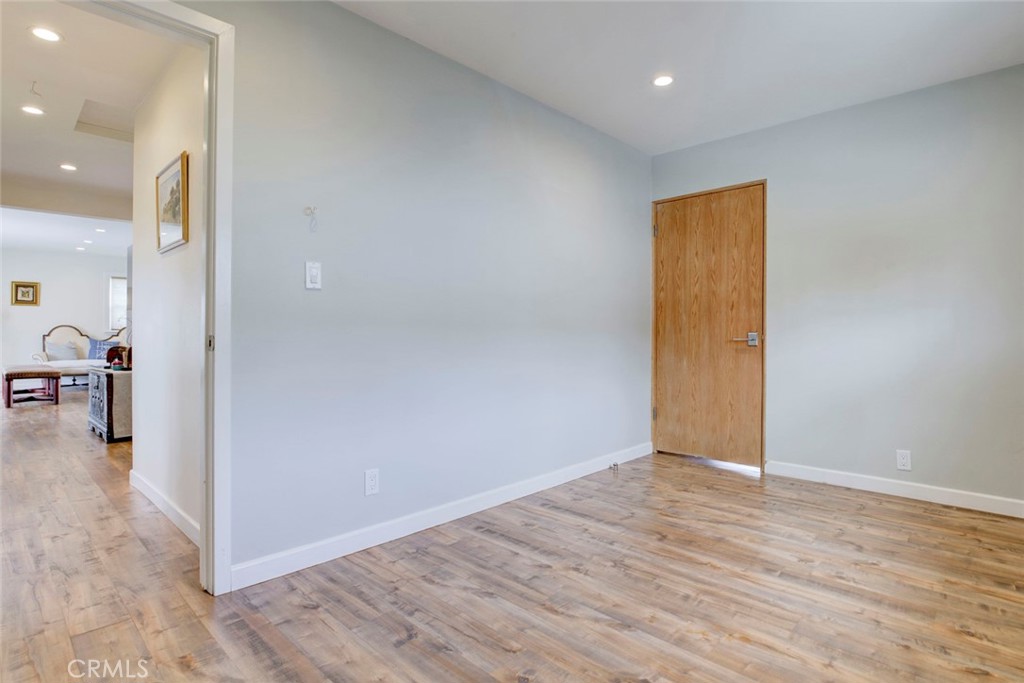 6911 Valmont Street Tujunga, CA 91042 - Photo 19 of 55 a view of a hallway with wooden floor
