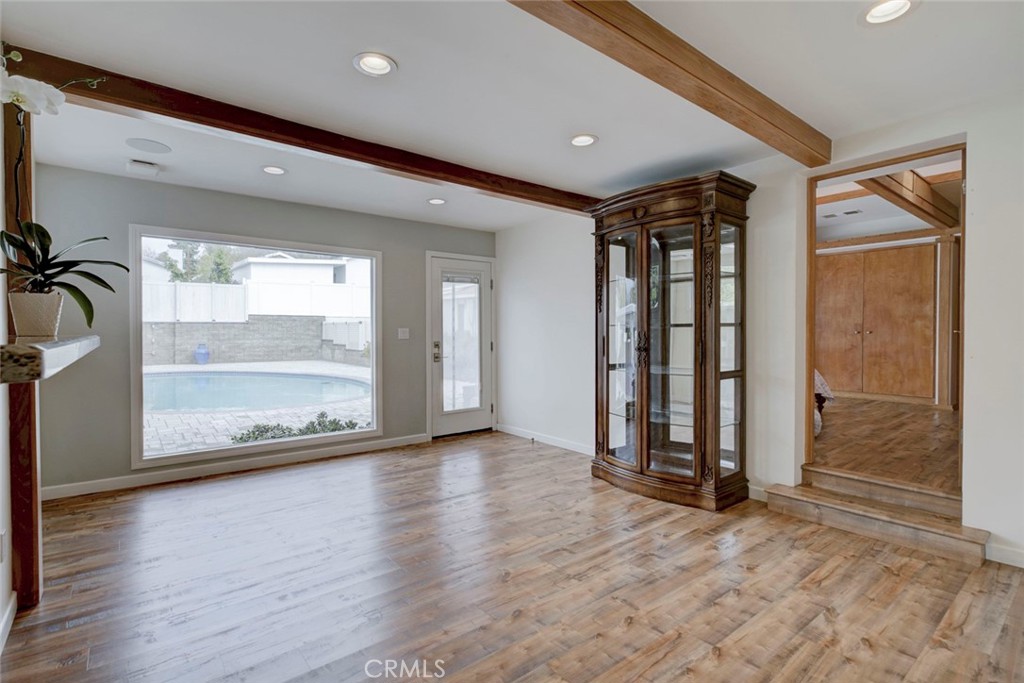 6911 Valmont Street Tujunga, CA 91042 - Photo 20 of 55 an empty room with wooden floor and windows