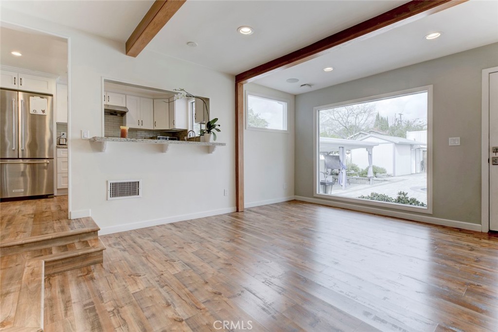 6911 Valmont Street Tujunga, CA 91042 - Photo 21 of 55 a view of kitchen with refrigerator and wooden floor