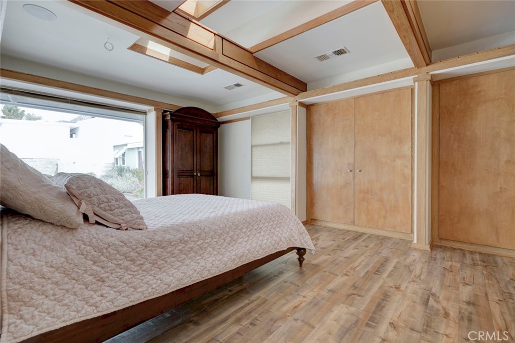 6911 Valmont Street Tujunga, CA 91042 - Photo 25 of 55 a bedroom with a large bed and a large window