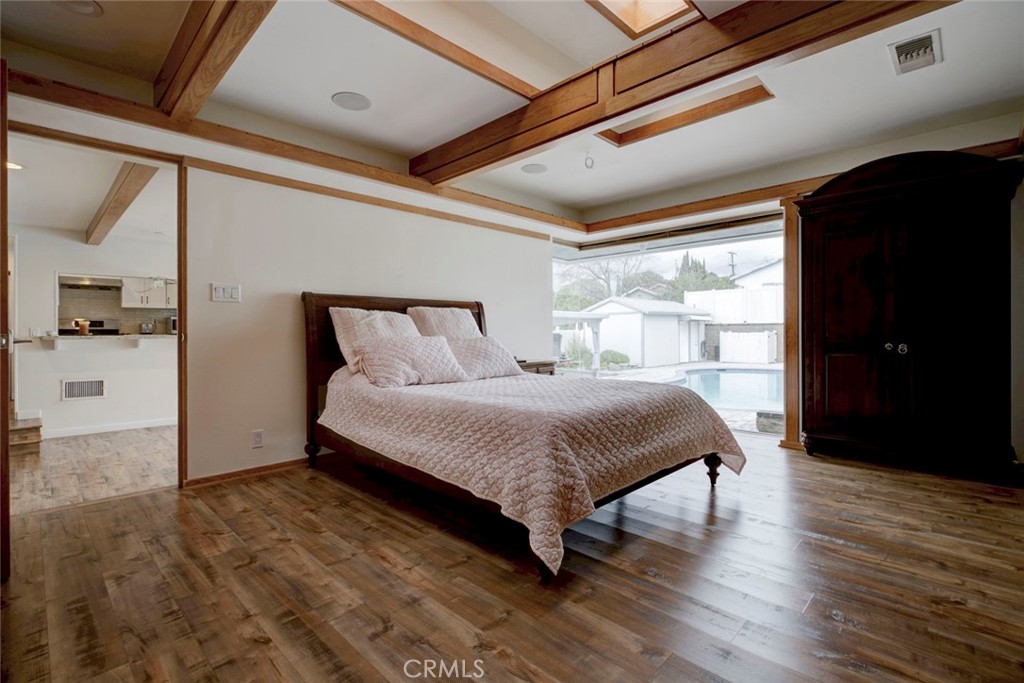 6911 Valmont Street Tujunga, CA 91042 - Photo 26 of 55 a bedroom with a bed and wooden floor