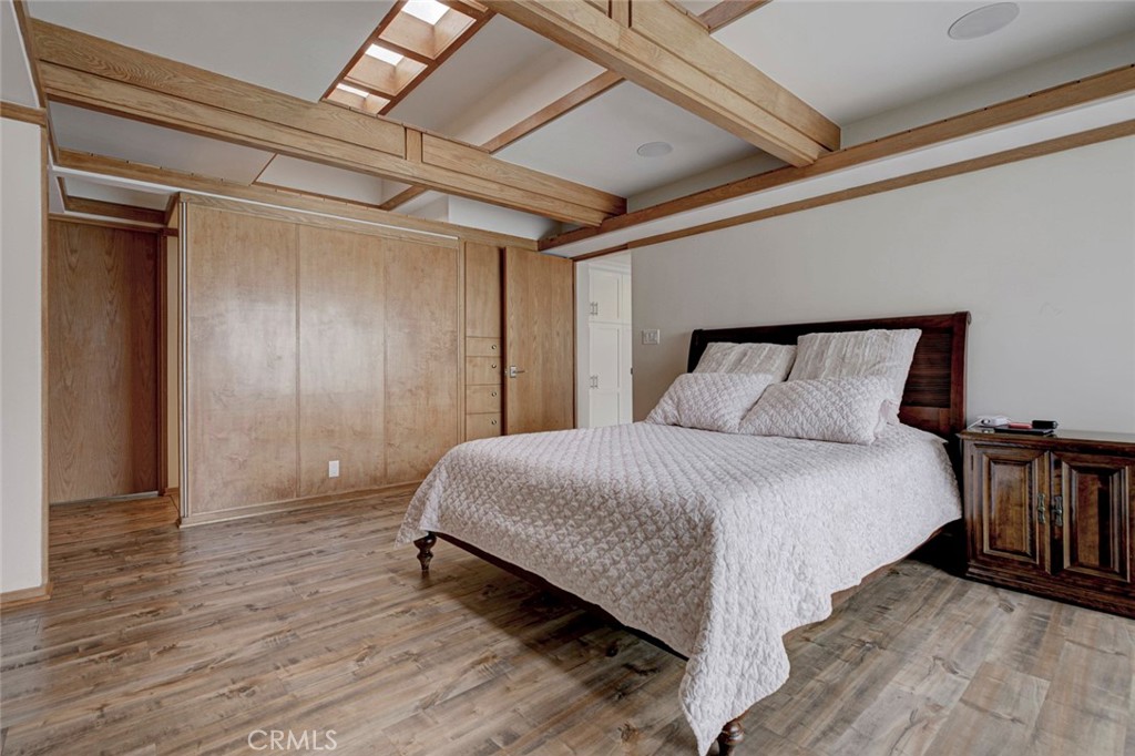 6911 Valmont Street Tujunga, CA 91042 - Photo 27 of 55 a spacious bedroom with a bed and a table