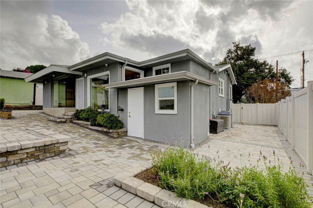 6911 Valmont Street Tujunga, CA 91042 - Photo 30 of 55 a white house that has tree in front of it