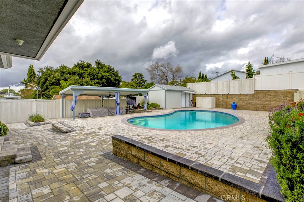 6911 Valmont Street Tujunga, CA 91042 - Photo 33 of 55 a view of a house with pool plants and large trees