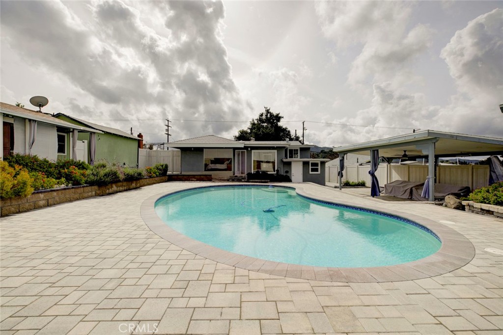 6911 Valmont Street Tujunga, CA 91042 - Photo 35 of 55 a view of a swimming pool with a patio