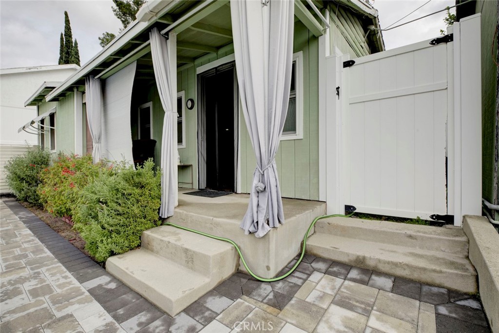6911 Valmont Street Tujunga, CA 91042 - Photo 41 of 55 a front view of small house with outdoor seating