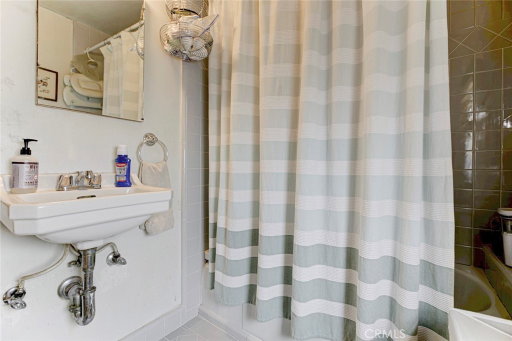 6911 Valmont Street Tujunga, CA 91042 - Photo 45 of 55 a bathroom with a sink and mirror