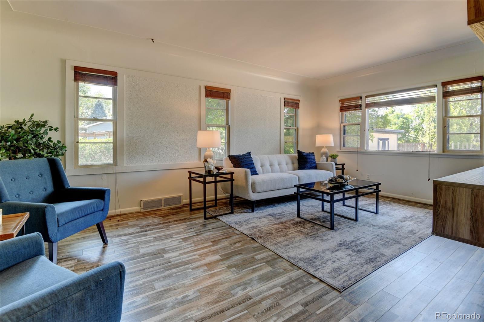 6788 Pierce Way Arvada, CO 80003 - Photo 11 of 28 a living room with furniture and a window