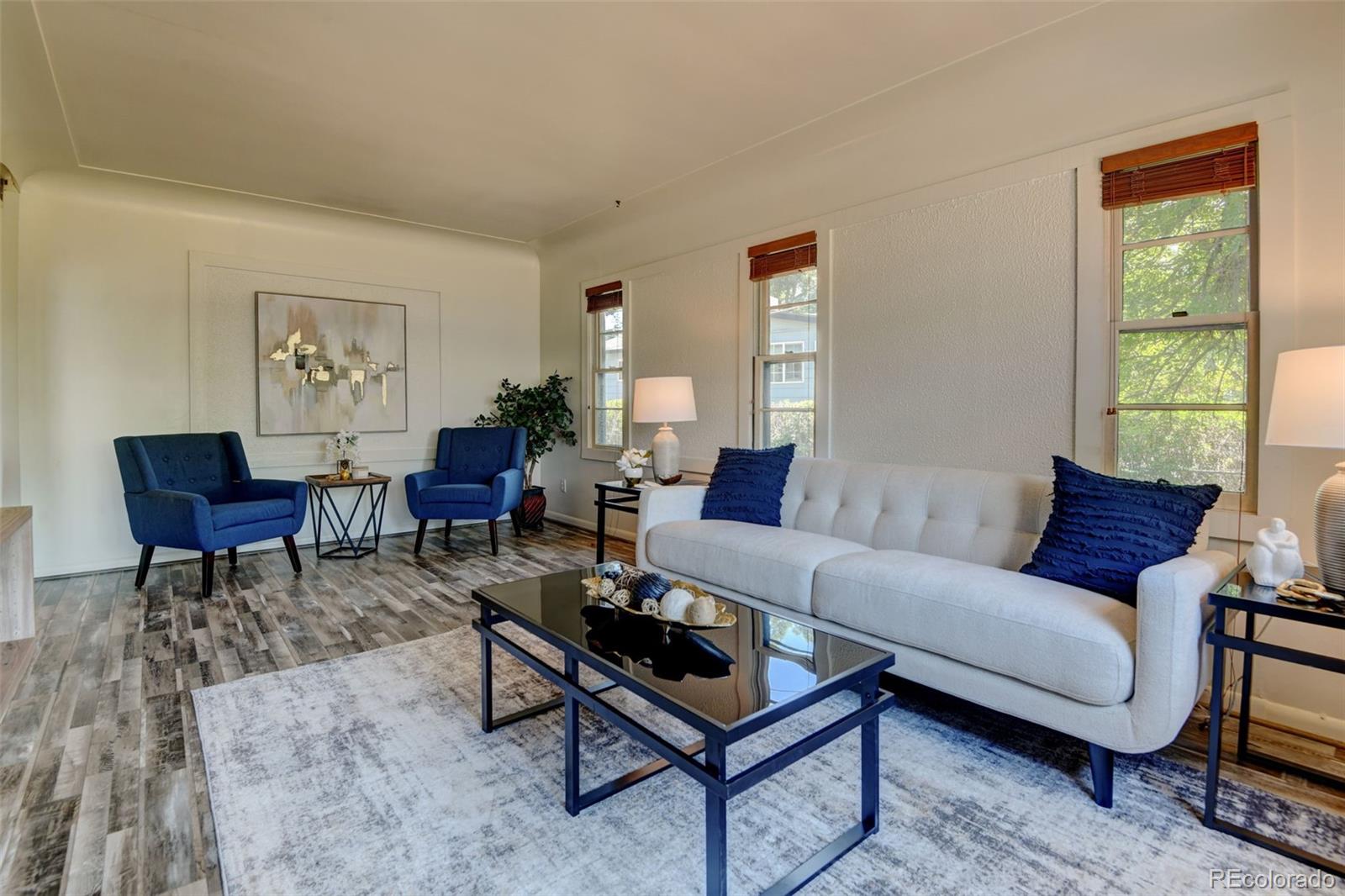 6788 Pierce Way Arvada, CO 80003 - Photo 12 of 28 a living room with furniture and a window