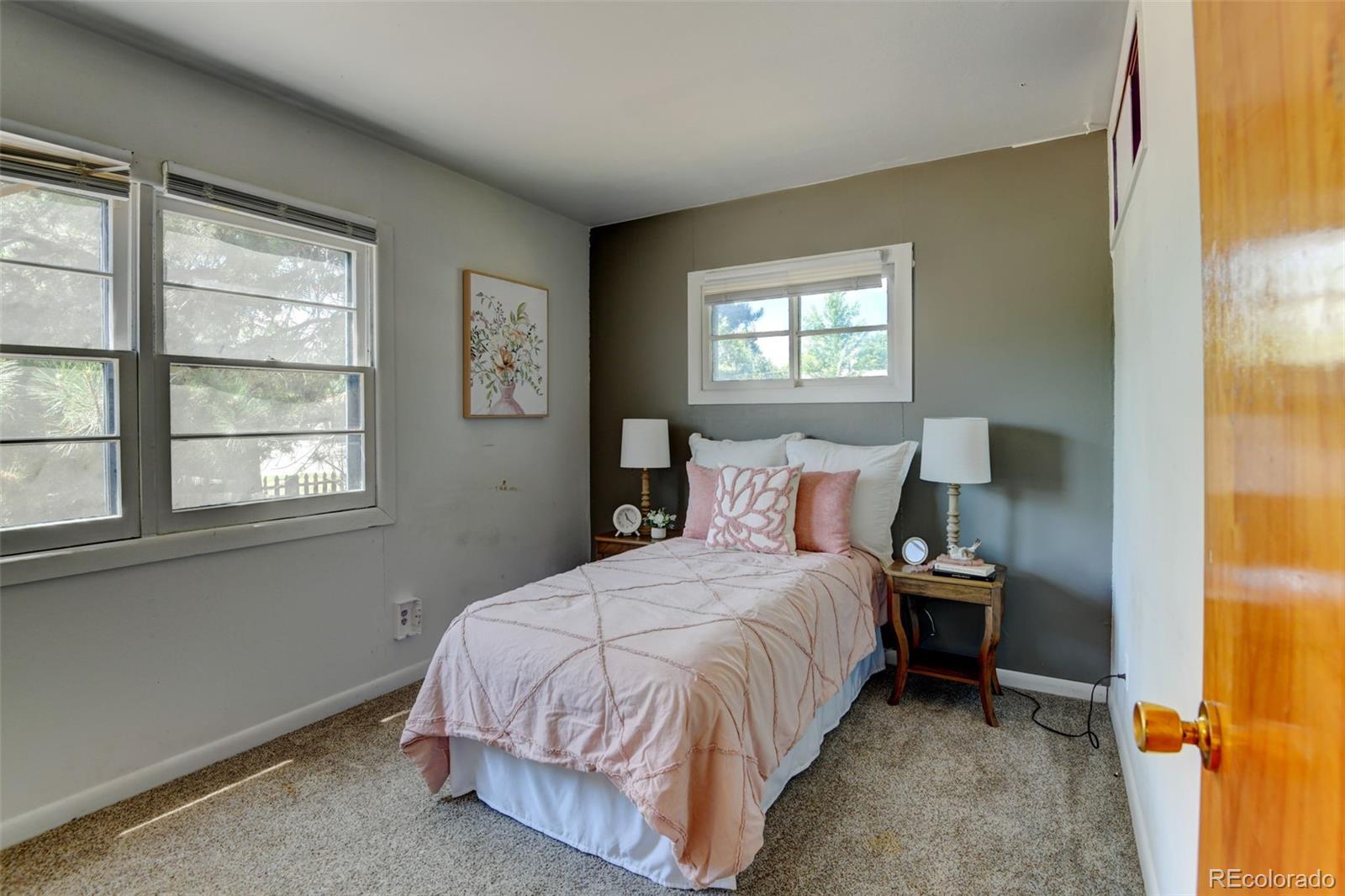 6788 Pierce Way Arvada, CO 80003 - Photo 17 of 28 a bedroom with a bed and a window